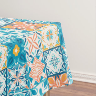 Ornate tiles in blue and orange tablecloth