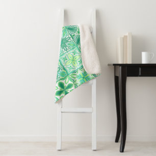 Ornate tiles in green and white sherpa blanket