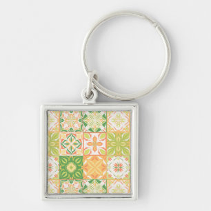 Ornate tiles in green and yellow key ring