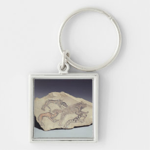 Ostracon depicting a dog chasing a hyena (limeston key ring