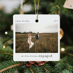 Our 1st Christmas Engaged Photo Keepsake Ceramic Ornament<br><div class="desc">A stylish photo holiday christmas tree ornament with classic typography "Our first christmas engaged" in black on a clean simple minimal white background. The photo, text, name/s and year can be easily customised to make this ornament unique and personal to you. A simple, minimalist and contemporary christmas design to announce...</div>