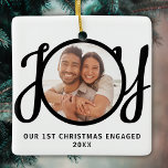 Our 1st Christmas Engaged Photo Keepsake Ceramic Ornament<br><div class="desc">This keepsake First Christmas Engaged photo ornament is decorated with the word JOY in black,  stylish script typography. Easily customisable.</div>