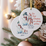 Our First Christmas as Family of Three Snowman Ceramic Tree Decoration<br><div class="desc">Christmas ornament keepsake for your first christmas as a family of three. The design features a cute family of 3 snowmen - mummy, daddy and baby - dressed in hats and scarves. The wording reads "Our First Christmas as a family of three". You can personalise the design with your names...</div>