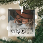 Our First Christmas Engaged Personalised Photo Glass Tree Decoration<br><div class="desc">An elegant keepsake of your engagement year,  this beautiful glass ornament displays a favourite photo with "our first Christmas engaged" overlaid in black lettering accented with stars. Personalise with your initials and the year.</div>