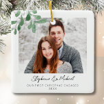 Our First Christmas Engaged Photo Ceramic Ornament<br><div class="desc">This First Christmas Engaged Photo Ornament is decorated with watercolor mistletoe and stylish script typography. Easily customisable with your photo, name, and year. Use the Design Tool to change the text size, style, or colour. Because we create our artwork you won't find this exact image from other designers. Original Watercolor...</div>