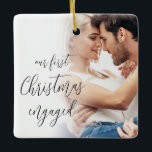 Our First Christmas Engaged Script Photo Names Ceramic Ornament<br><div class="desc">Our First Christmas Engaged Script Custom Photo Names. A fully customisable design especially to celebrate the happy couple’s first Christmas after their engagement and memento for the tree in Christmasses to come.. A beautiful calligraphy script for the text on the front and names on the back. Easily personalise with your...</div>