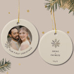 Our First Christmas Newlywed Ornament<br><div class="desc">Celebrate your first Christmas as a newlywed couple with this elegant Our First Christmas Newlywed Ornament. The front of this charming ornament features a gleaming champagne gold snowflake on a light background, beautifully framing the words "Our First Christmas." Turn to the back to find a delicate snowflake design accompanied by...</div>