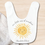 Our Little Ray Of Sunshine Bib<br><div class="desc">This cute baby bib is decorated with a watercolor smiling sun and the words " Our Little Ray Of Sunshine" in stylish script typography.
Easily customisable.
Original Watercolor © Michele Davies.</div>