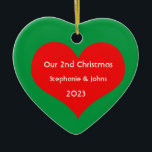 Our Second Christmas Together Cute Red Heart 2023 Ceramic Tree Decoration<br><div class="desc">Personalised names and printed with cute red heart design in solid green background. Feel free to customise by adding your own texts,  names or photos. You can add your photo on the back side of the ornament easily!
The colour of the background can also be changed as you want.</div>