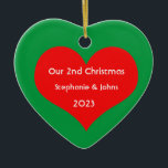 Our Second Christmas Together Cute Red Heart 2023 Ceramic Tree Decoration<br><div class="desc">Personalised names and printed with cute red heart design in solid green background. Feel free to customise by adding your own texts,  names or photos. You can add your photo on the back side of the ornament easily!
The colour of the background can also be changed as you want.</div>