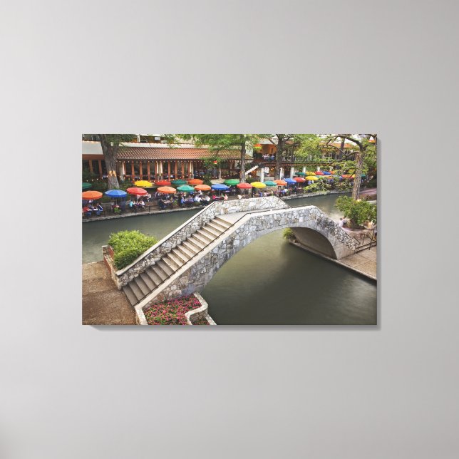 Outdoor cafe along River Walk and bridge over 2 Canvas Print (Front)