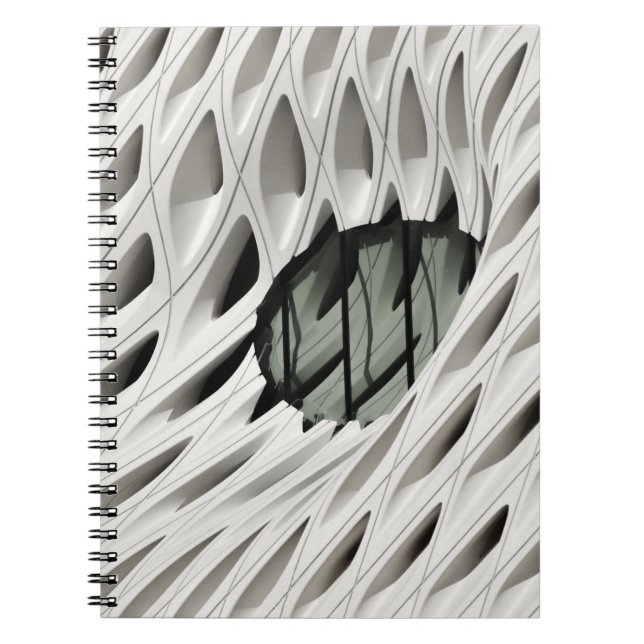 Oval black tint glass panel on white surface notebook (Front)