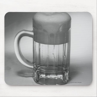 Overflowing beer glass mouse mat