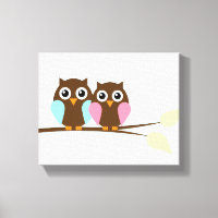 Owl couple on a branch