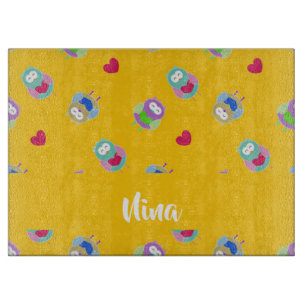 Owls with hearts on orange cutting board