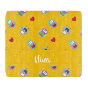Owls with hearts on orange cutting board