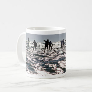 Paddleboarders on the sparkling sea coffee mug