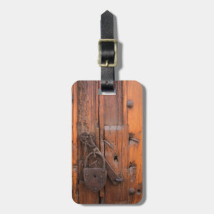 Padlock on wooden door luggage tag