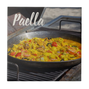 Paella is cooked on a grill gift for chef tile