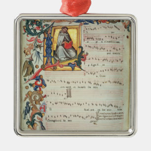Page of musical notation with a historiated metal tree decoration