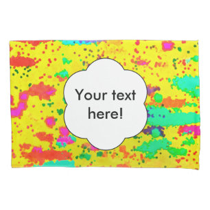 Paint splashes on a yellow background pillowcase