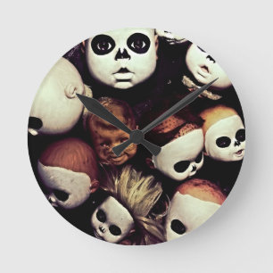 Painted baby doll heads round clock