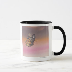 Painting depicting butterfly in flight mug