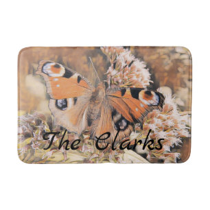 Painting of an orange butterfly on flowers bath ma mat
