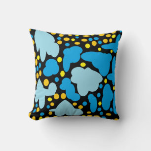 Pale blue puffs with lemon dots on black cushion