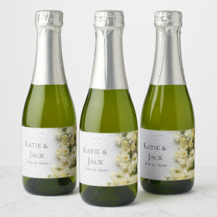Pale narcissus flowers on texture sparkling wine label