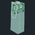 Palm Beach Christmas Wine Gift Bag<br><div class="desc">Tropical style gift bag features a replica of my original hand painted watercolor monstera leaves with pink and green stripes. These gift bags coordinates beautifully with Do Tell A Belle's Palm Beach Christmas suite. Perfect for holiday wine gifts for the wine lover in your life. To see matching items visit...</div>