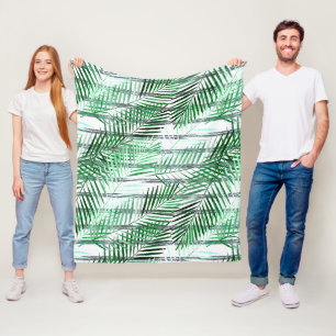Palm leaves on a striped black and white backgroun fleece blanket