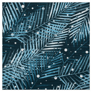 Palm leaves on blue with white polka dots. fabric