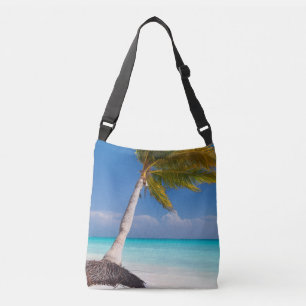 Palm tree on the beautiful white sand beach crossbody bag
