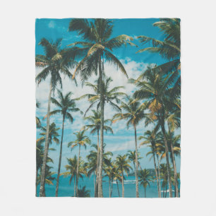 Palm trees above the ocean, vintage toned and retr fleece blanket