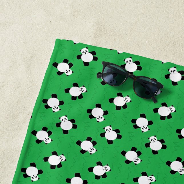 panda bear on green grass beach towel (In Situ)