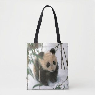 Panda cub on snow, Wolong, Sichuan, China Tote Bag