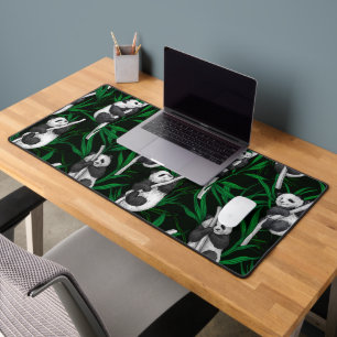 Panda cubs on dark green desk mat