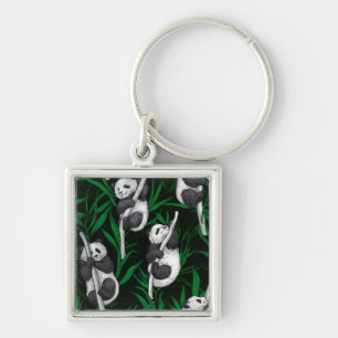 Panda cubs on dark green key ring