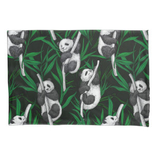 Panda cubs on dark green pillowcase
