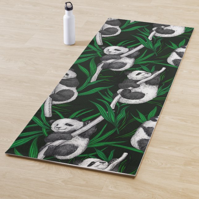 Panda cubs on dark green yoga mat (In Situ)
