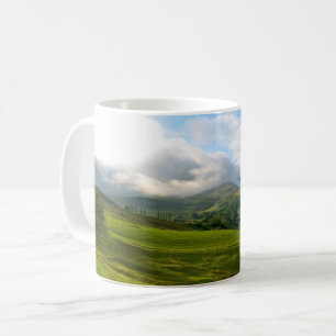 Panoramic mountain meadow vista coffee mug