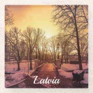 Panoramic view of snowy park during sunset in Riga Glass Coaster