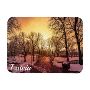 Panoramic view of snowy park during sunset magnet