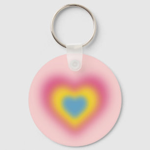 Pansexual flag colors on blurred heart key ring