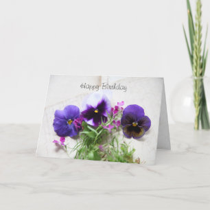 Pansies and lobelia on old handwriting card