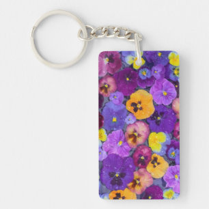 Pansy flowers floating in bird bath with dew key ring