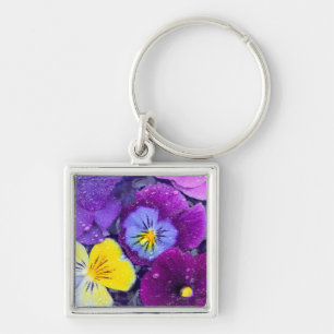 Pansy flowers floating in bird bath with dew key ring