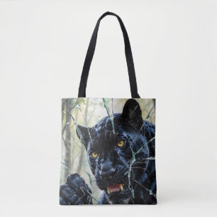 Panther breaking through  tote bag