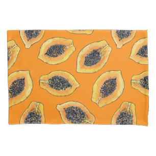 Papaya slices on orange pillowcase